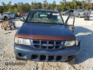 2002 Isuzu Rodeo S with VIN 4S2CK58W124307433, listed as a Copart auction lot 75447074 with 129,163 mi miles and Salvage title. Bid and sale history available at DreamBid. Image 5.