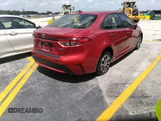 2021 Toyota Corolla Hybrid LE with VIN JTDEAMDE5MJ012662, listed as a IAAI auction lot 41421205 with 138,533 mi miles. Bid and sale history available at carsss.com. Image 4.