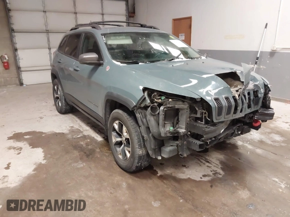 2015 Jeep Cherokee Trailhawk with VIN 1C4PJMBS6FW724931, listed as a IAAI auction lot 41602181 with 153,340 mi miles and . Bid and sale history available at carsss.com. Image 1.