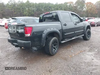 2007 Nissan Titan SE with VIN 1N6BA07A17N212890, listed as a IAAI auction lot 41034412 with 211,881 mi miles and . Bid and sale history available at DreamBid. Image 4.