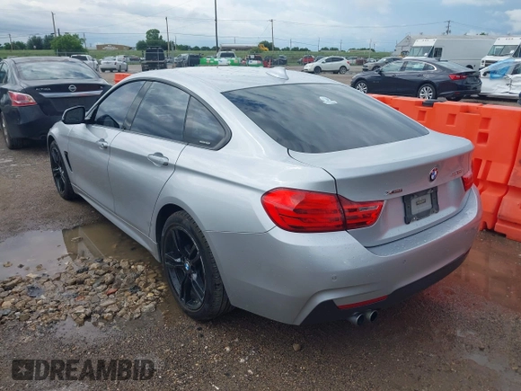 2015 BMW 4 Series 428i xDrive with VIN WBA4C9C50FD330482, listed as a IAAI auction lot 42116547 with 192,739 mi miles and . Bid and sale history available at DreamBid. Image 3.