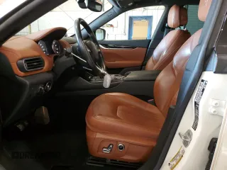 2021 Maserati Levante z VIN ZN661XUA1MX370792, wystawiony jako Copart lot #83474194 z przebiegiem 89 428 mil mil oraz Szkoda całkowita • Salvage title. Historia ofert i sprzedaży dostępna na DreamBid. Obrazek 7.