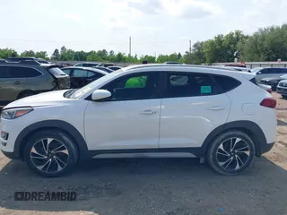 2019 Hyundai Tucson Sport with VIN KM8J33AL1KU861698, listed as a IAAI auction lot 42129173 with 100,160 mi miles. Bid and sale history available at carsss.com. Image 14.