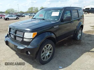 2011 Dodge Nitro Heat with VIN 1D4PU4GX9BW607580, listed as a IAAI auction lot 42105529 with 143,795 mi miles. Bid and sale history available at carsss.com. Image 2.