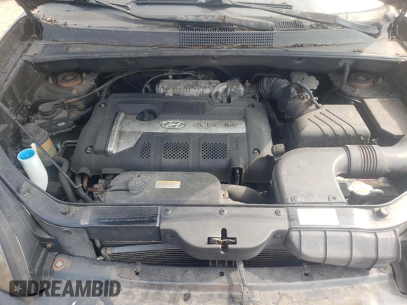 2005 Hyundai Tucson GL with VIN KM8JM12BX5U075930, listed as a Copart auction lot 67500484 with 141,028 mi miles and Salvage Title. Bid and sale history available at carsss.com. Image 12.