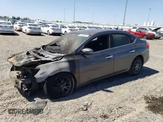 2019 Nissan Sentra S z VIN 3N1AB7AP4KY297854, wystawiony jako Copart lot #57048975 z przebiegiem Nie podano mil oraz Szkoda całkowita • Salvage title. Historia ofert i sprzedaży dostępna na DreamBid. Obrazek 1.