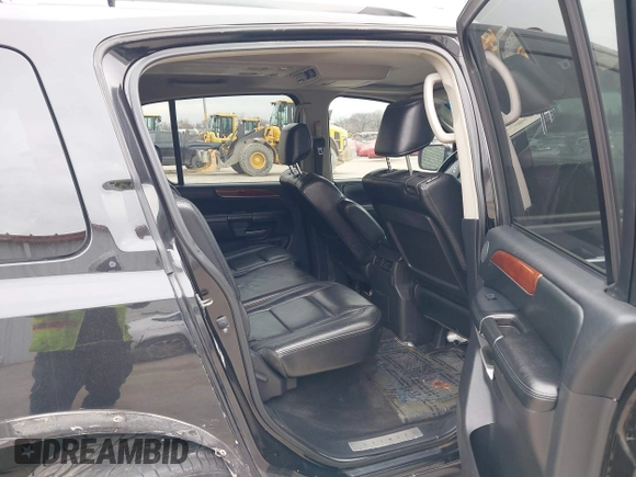 2009 Infiniti QX56 with VIN 5N3AA08C09N902599, listed as a IAAI auction lot 41502266 with 174,823 mi miles. Bid and sale history available at carsss.com. Image 8.