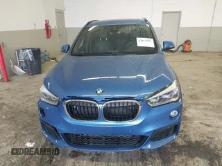 2019 BMW X1 xDrive28i with VIN WBXHT3C53K5L36690, listed as a IAAI auction lot 42012992 with 70,339 mi miles. Bid and sale history available at carsss.com. Image 12.