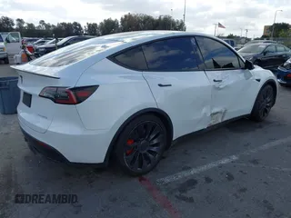 2022 Tesla Model Y Performance with VIN 7SAYGDEF1NF559572, listed as a IAAI auction lot 41516070 with 43,240 mi miles and . Bid and sale history available at DreamBid. Image 4.