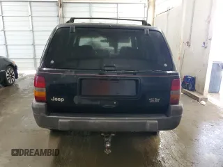 1996 Jeep Grand Cherokee Laredo with VIN 1J4GZ58S0TC402024, listed as a Copart auction lot 65074774 with 163,477 mi miles and Salvage Title. Bid and sale history available at carsss.com. Image 6.