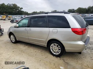 2009 Toyota Sienna XLE with VIN 5TDBK22C89S027706, listed as a Copart auction lot 88672015 with 215,515 mi miles and Salvage Title. Bid and sale history available at DreamBid. Image 2.