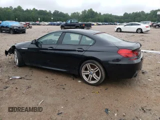 2017 BMW 6 Series 640i xDrive with VIN WBA6D2C58HGT66290, listed as a Copart auction lot 65738404 with 105,783 mi miles and Salvage Title. Bid and sale history available at carsss.com. Image 2.