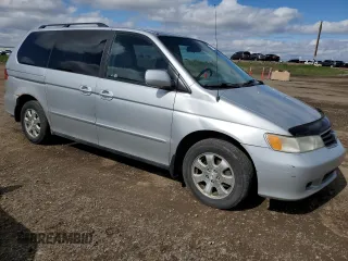 2002 Honda Odyssey EX z VIN 2HKRL186X2H006763, wystawiony jako Copart lot #57317075 z przebiegiem 282 090 mil mil oraz Szkoda całkowita • Salvage title. Historia ofert i sprzedaży dostępna na DreamBid. Obrazek 4.