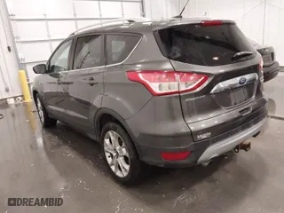2015 Ford Escape Titanium with VIN 1FMCU0J97FUC25446, listed as a IAAI auction lot 41708585 with 150,010 mi miles. Bid and sale history available at carsss.com. Image 3.