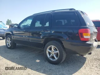 2002 Jeep Grand Cherokee Limited with VIN 1J8GW58NX2C158544, listed as a Copart auction lot 54937665 with 259,089 mi miles and Salvage title. Bid and sale history available at DreamBid. Image 2.