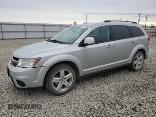 2012 Dodge Journey SXT z VIN 3C4PDDBG4CT297642, wystawiony jako Copart lot #57636895 z przebiegiem 226 992 mil mil oraz Czysty tytuł • Clean title. Historia ofert i sprzedaży dostępna na DreamBid. Obrazek 1.