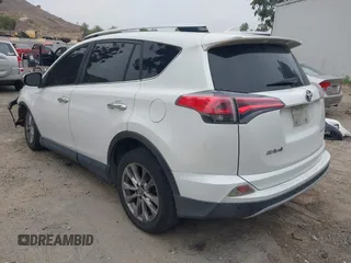 2016 Toyota RAV4 Limited with VIN JTMYFREV2GJ065656, listed as a IAAI auction lot 42575320 with 124,648 mi miles and . Bid and sale history available at DreamBid. Image 3.