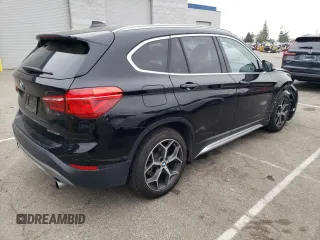2018 BMW X1 sDrive28i with VIN WBXHU7C32J5L06825, listed as a Copart auction lot 49403143 with 93,723 mi miles. Bid and sale history available at carsss.com. Image 3.