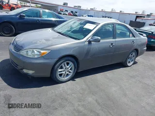 2003 Toyota Camry LE with VIN JTDBE32K130149032, listed as a IAAI auction lot 42063174 with 241,424 mi miles and . Bid and sale history available at DreamBid. Image 14.