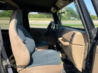 1999 Jeep Wrangler Sahara with VIN 1J4FY49S5XP496486, listed as a Copart auction lot 77263014 with 128,498 mi miles and Clean Title. Bid and sale history available at carsss.com. Image 5.