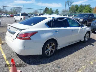 2014 Nissan Altima SV with VIN 1N4AL3AP6EC163563, listed as a IAAI auction lot 41964614 with 188,516 mi miles and . Bid and sale history available at DreamBid. Image 4.
