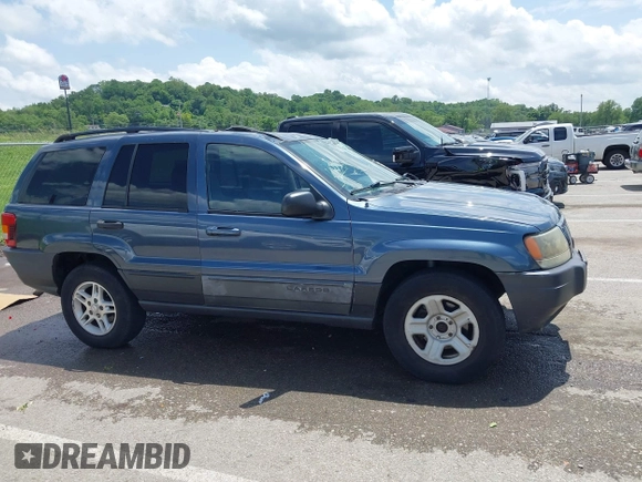 2004 Jeep Grand Cherokee Laredo with VIN 1J4GX48S44C205469, listed as a IAAI auction lot 42310571 with 154,929 mi miles and . Bid and sale history available at DreamBid. Image 13.