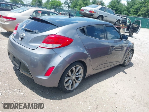 2012 Hyundai Veloster w/Black Int with VIN KMHTC6ADXCU061325, listed as a IAAI auction lot 42556398 with 122,954 mi miles and . Bid and sale history available at DreamBid. Image 4.