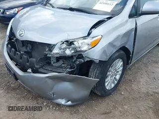 2015 Toyota Sienna XLE with VIN 5TDYK3DC7FS659864, listed as a IAAI auction lot 41958112 with 121,257 mi miles and . Bid and sale history available at DreamBid. Image 6.