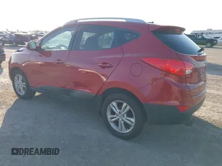 2013 Hyundai Tucson GLS with VIN KM8JU3AC6DU763590, listed as a IAAI auction lot 41999555 with 149,960 mi miles. Bid and sale history available at carsss.com. Image 3.
