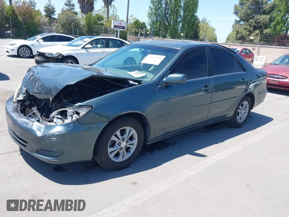 2004 Toyota Camry LE with VIN 4T1BF30K64U067898, listed as a IAAI auction lot 42131958 with 209,702 mi miles. Bid and sale history available at carsss.com. Image 2.
