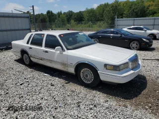 1996 Lincoln Town Car Executive z VIN 1LNLM81W4TY641611, wystawiony jako Copart lot #44939405 z przebiegiem 296 702 mil mil oraz Szkoda całkowita • Salvage title. Historia ofert i sprzedaży dostępna na DreamBid. Obrazek 4.