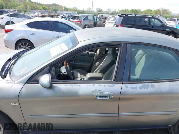 2005 Ford Taurus SEL z VIN 1FAFP56SX5A298284, wystawiony jako IAAI lot #42092395 z przebiegiem Nie podano mil oraz . Historia ofert i sprzedaży dostępna na DreamBid. Obrazek 14.