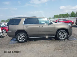 2016 GMC Yukon SLT with VIN 1GKS1BKC9GR328861, listed as a IAAI auction lot 42010839 with 200,711 mi miles. Bid and sale history available at carsss.com. Image 13.