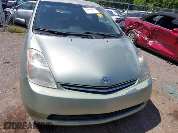 2007 Toyota Prius z VIN JTDKB20UX77647346, wystawiony jako IAAI lot #42339384 z przebiegiem 168 836 mil mil oraz . Historia ofert i sprzedaży dostępna na DreamBid. Obrazek 6.