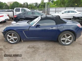 2009 Saturn Sky Red Line z VIN 1G8MT35X09Y105064, wystawiony jako IAAI lot #42197028 z przebiegiem 106 673 mil mil oraz . Historia ofert i sprzedaży dostępna na DreamBid. Obrazek 14.