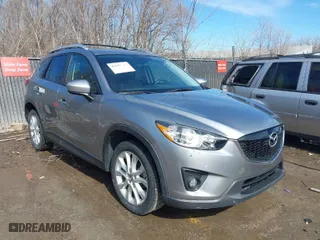 2014 Mazda CX-5 Grand Touring with VIN JM3KE2DY8E0375025, listed as a IAAI auction lot 41657755 with 103,601 mi miles. Bid and sale history available at carsss.com. Image 1.