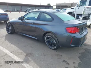 2018 BMW M2 with VIN WBS1J5C50JVE51869, listed as a IAAI auction lot 41814404 with 69,684 mi miles. Bid and sale history available at carsss.com. Image 3.
