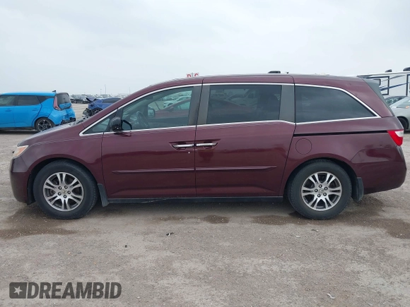 2012 Honda Odyssey EX-L with VIN 5FNRL5H61CB108301, listed as a IAAI auction lot 41939536 with 225,476 mi miles and . Bid and sale history available at DreamBid. Image 14.