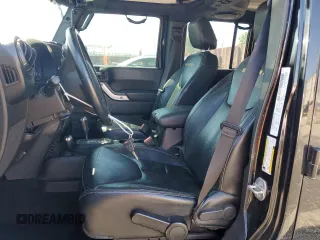 2014 Jeep Wrangler Unlimited Sahara z VIN 1C4BJWEG4EL164226, wystawiony jako Copart lot #53849355 z przebiegiem 82 145 mil mil oraz Szkoda całkowita • Salvage title. Historia ofert i sprzedaży dostępna na DreamBid. Obrazek 7.
