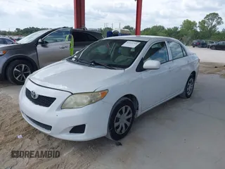 2010 Toyota Corolla with VIN 1NXBU4EE0AZ335239, listed as a IAAI auction lot 42155710 with 215,134 mi miles. Bid and sale history available at carsss.com. Image 2.