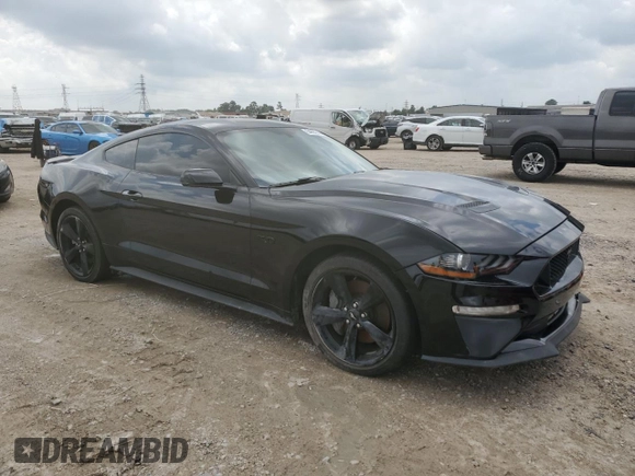 2023 Ford Mustang GT with VIN 1FA6P8CF7P5304031, listed as a Copart auction lot 54693515 with 27,048 mi miles and Salvage Title. Bid and sale history available at carsss.com. Image 4.