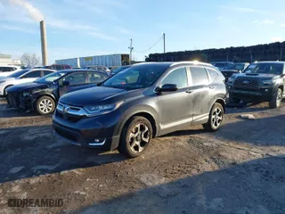 2017 Honda CR-V Touring with VIN 2HKRW2H90HH647274, listed as a IAAI auction lot 41572666 with 95,264 mi miles. Bid and sale history available at carsss.com. Image 2.