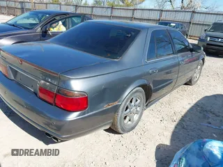 2003 Cadillac Seville Luxury SLS z VIN 1G6KS54Y43U158390, wystawiony jako IAAI lot #41977830 z przebiegiem 299 000 mil mil oraz . Historia ofert i sprzedaży dostępna na DreamBid. Obrazek 4.