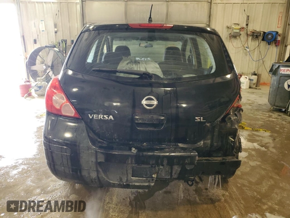 2009 Nissan Versa 1.8 SL with VIN 3N1BC13E39L351372, listed as a Copart auction lot 87274254 with 147,733 mi miles and Salvage Title. Bid and sale history available at carsss.com. Image 6.
