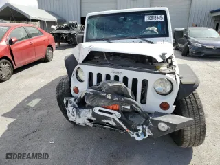 2013 Jeep Wrangler Unlimited Sport with VIN 1C4BJWDG7DL634412, listed as a Copart auction lot 50648545 with 77,014 mi miles and Salvage Title. Bid and sale history available at carsss.com. Image 5.