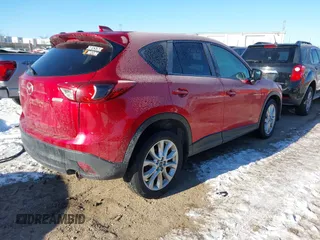 2015 Mazda CX-5 Grand Touring with VIN JM3KE4DY0F0538246, listed as a IAAI auction lot 41629662 with 87,788 mi miles. Bid and sale history available at carsss.com. Image 4.