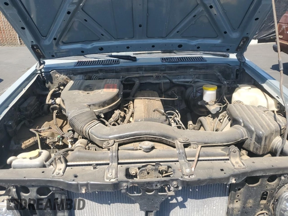 1990 Nissan Frontier with VIN 1N6SD11S9LC321876, listed as a Copart auction lot 59913575 with 119,909 mi miles and Salvage title. Bid and sale history available at DreamBid. Image 11.