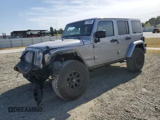 2014 Jeep Wrangler Unlimited Sahara with VIN 1C4HJWEG1EL126611, listed as a Copart auction lot 57169485 with 122,000 mi miles and Salvage title. Bid and sale history available at DreamBid. Image 1.