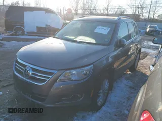 2010 Volkswagen Tiguan SEL with VIN WVGBV7AX0AW000279, listed as a IAAI auction lot 41389452 with 87,258 mi miles and . Bid and sale history available at DreamBid. Image 2.
