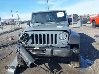 2015 Jeep Wrangler Unlimited Willys Wheeler with VIN 1C4BJWDG4FL589822, listed as a IAAI auction lot 41732614 with 149,112 mi miles and . Bid and sale history available at DreamBid. Image 13.